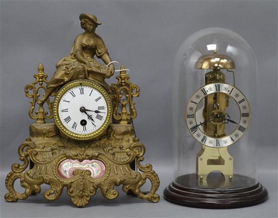 A Hermle, West Germany brass skeleton mantel clock under glass dome and a spelter figural mantel clock, tallest 30.5cm (2)